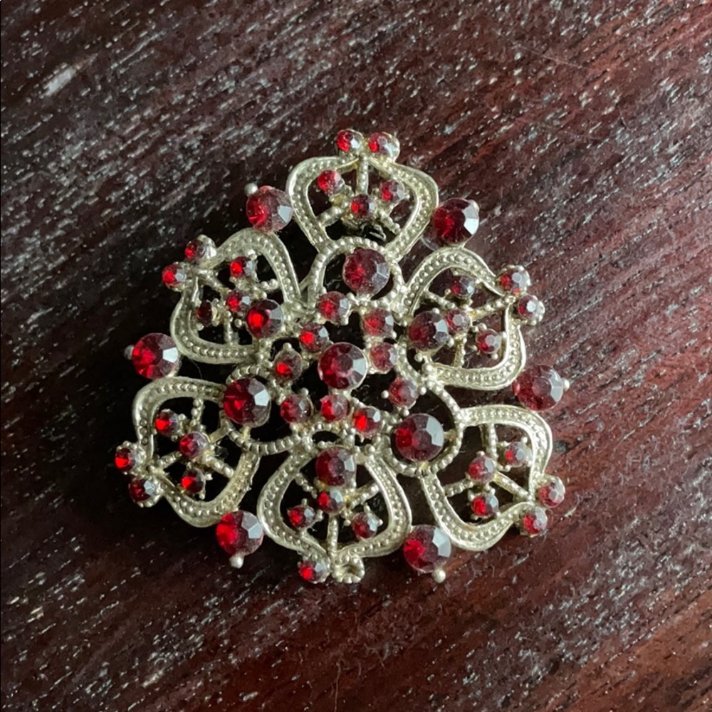 Red crystal and silver brooch